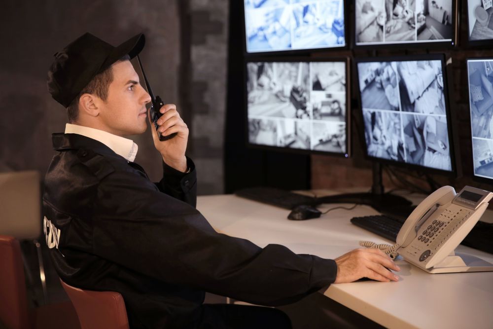 Security Guard at A Desk, Looking at Monitors — Safe Guard Squad in Lismore, NSW