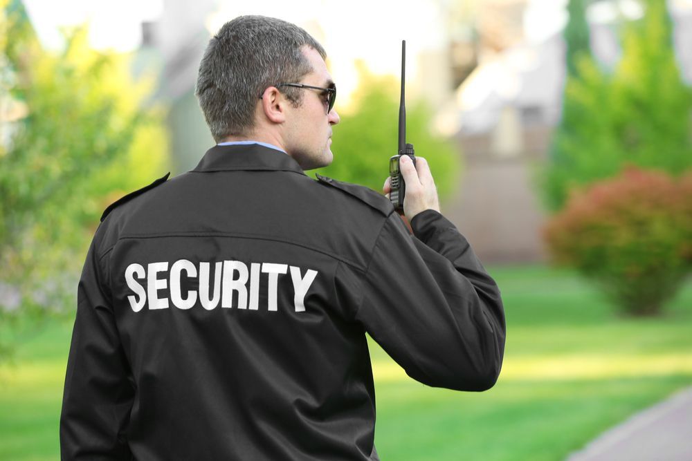 Security Guard Wearing Sunglasses and Jacket — Safe Guard Squad in Lismore, NSW