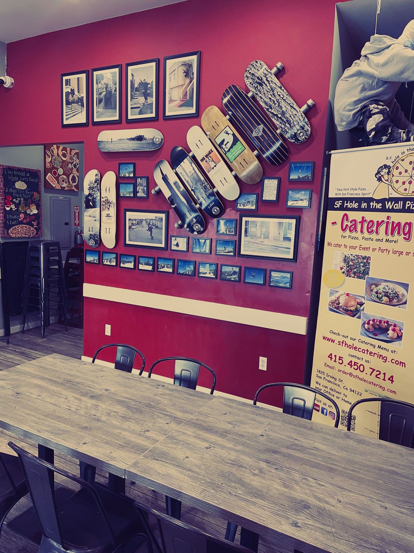 A room with a table and chairs and a sign that says catering