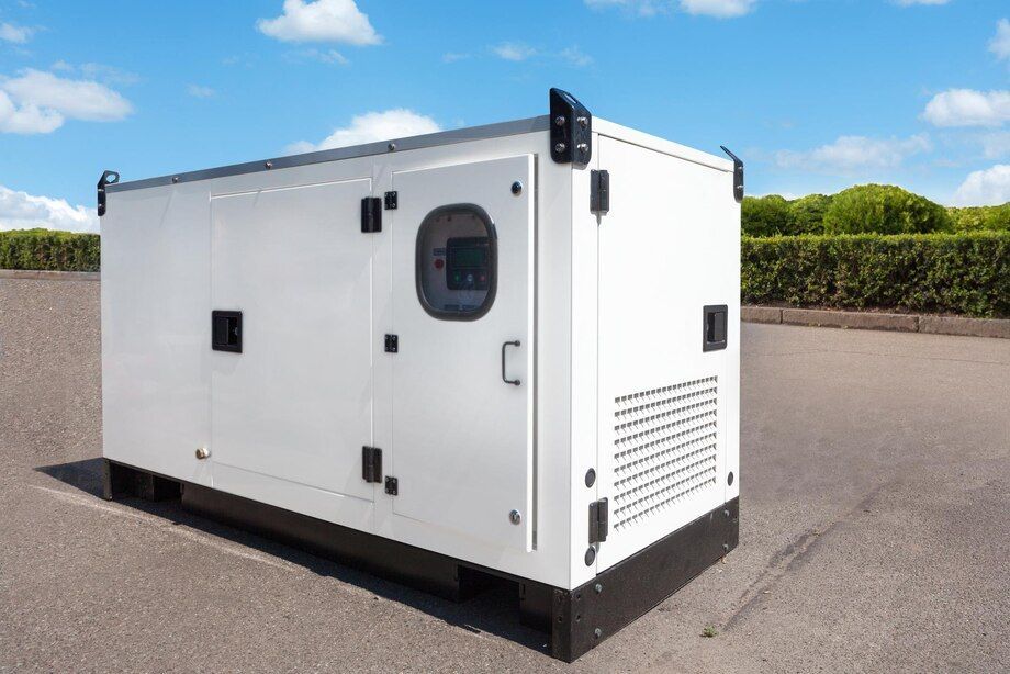 White portable generator enclosure on a paved lot, with black vents and a round window.