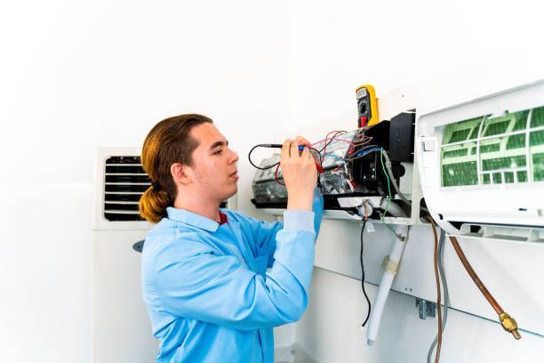 Trade school student training on home air conditioner repair