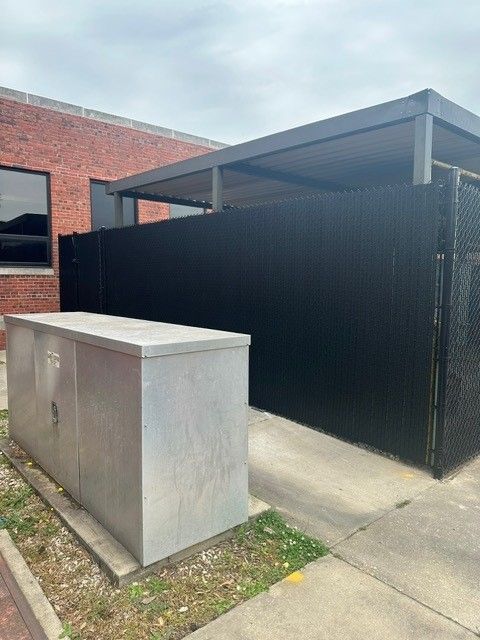 Utility box and black fence
