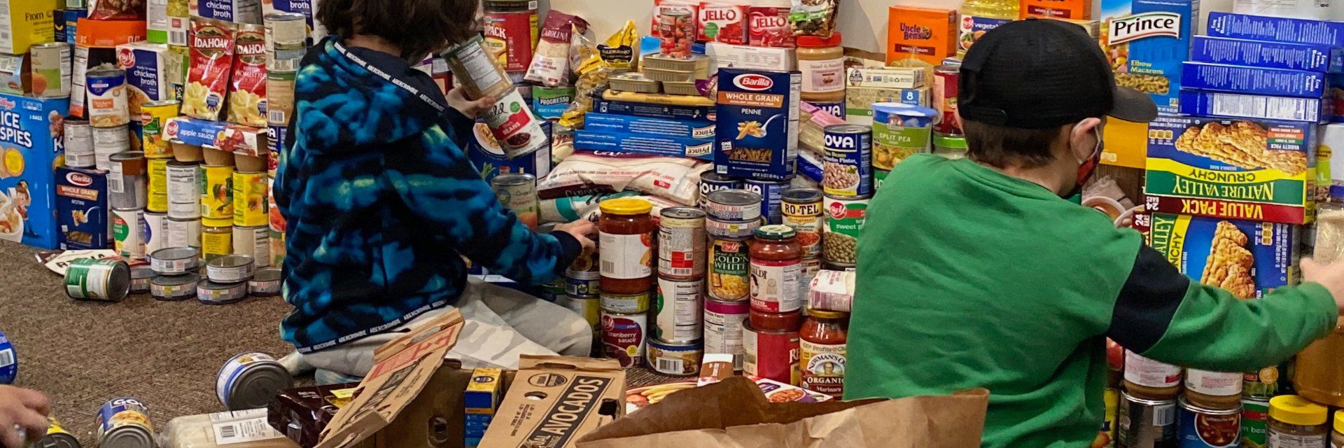 Elementary aged children and canned food drive