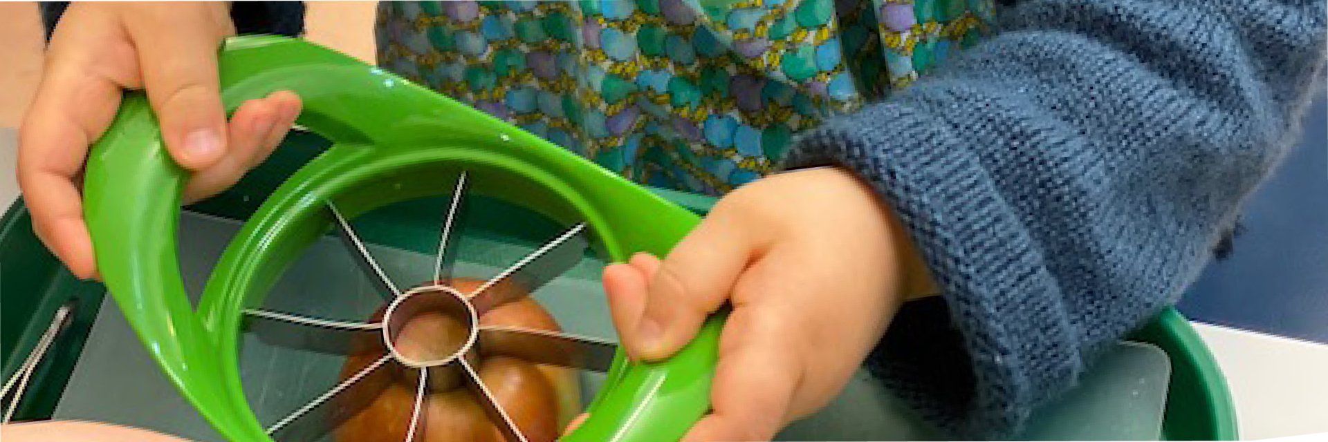 Young child with apple slicer/corer