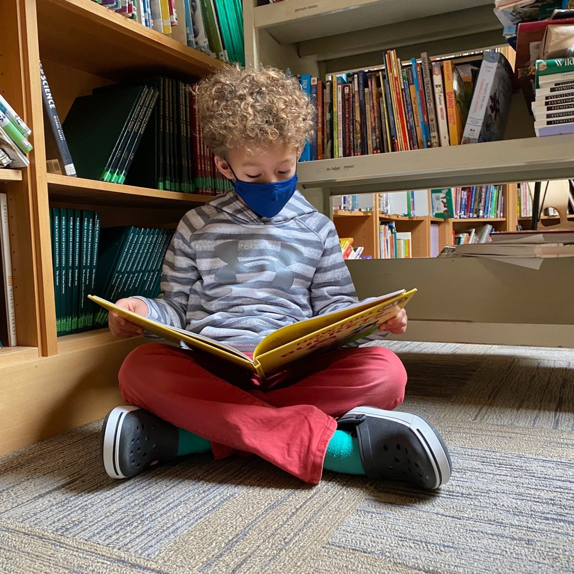 Elementary student with floor desk and lesson