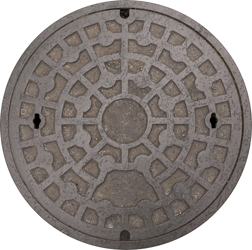 A manhole cover with a circular pattern on it A manhole cover with a circular pattern on it