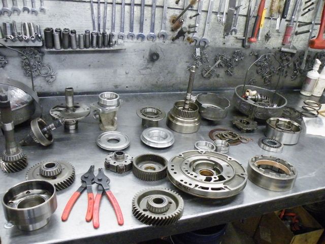 A table with a lot of gears and tools on it