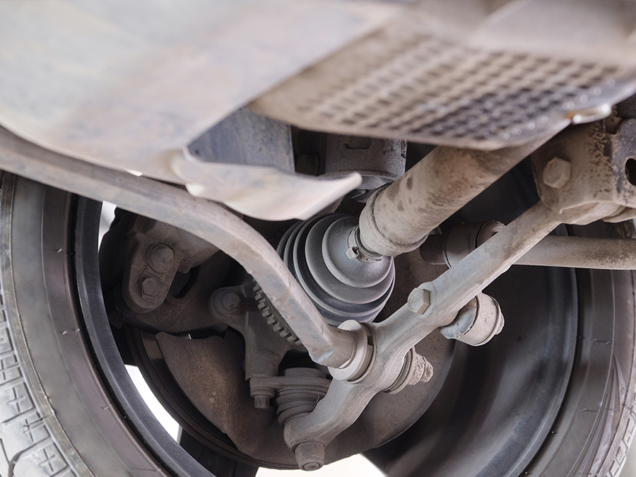 A close up of the underside of a car 's suspension system