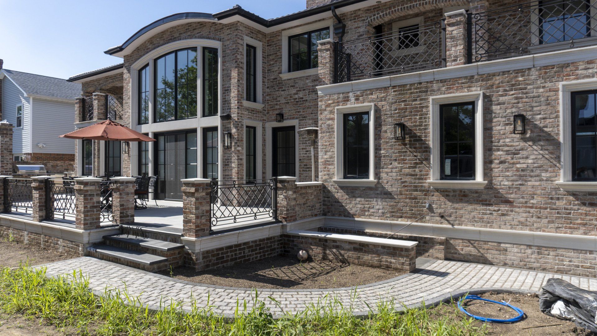 Brick House With Pavement — Queens, NY — Dean Masonry Supply