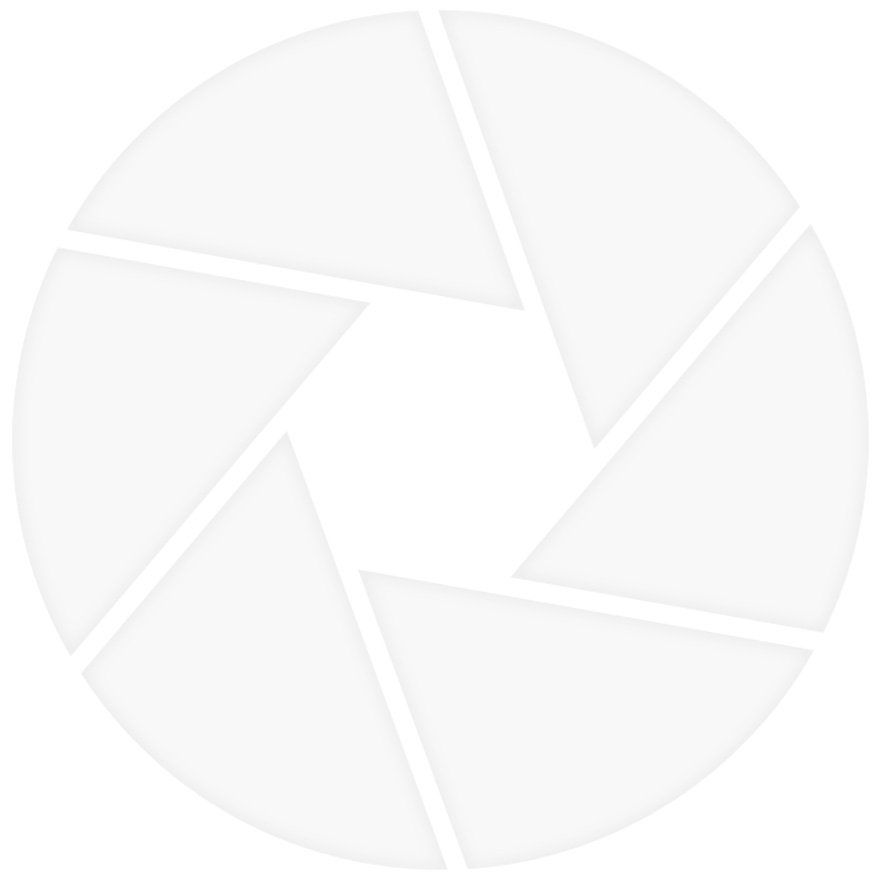 Aperture symbol, white blades forming a circular shape.