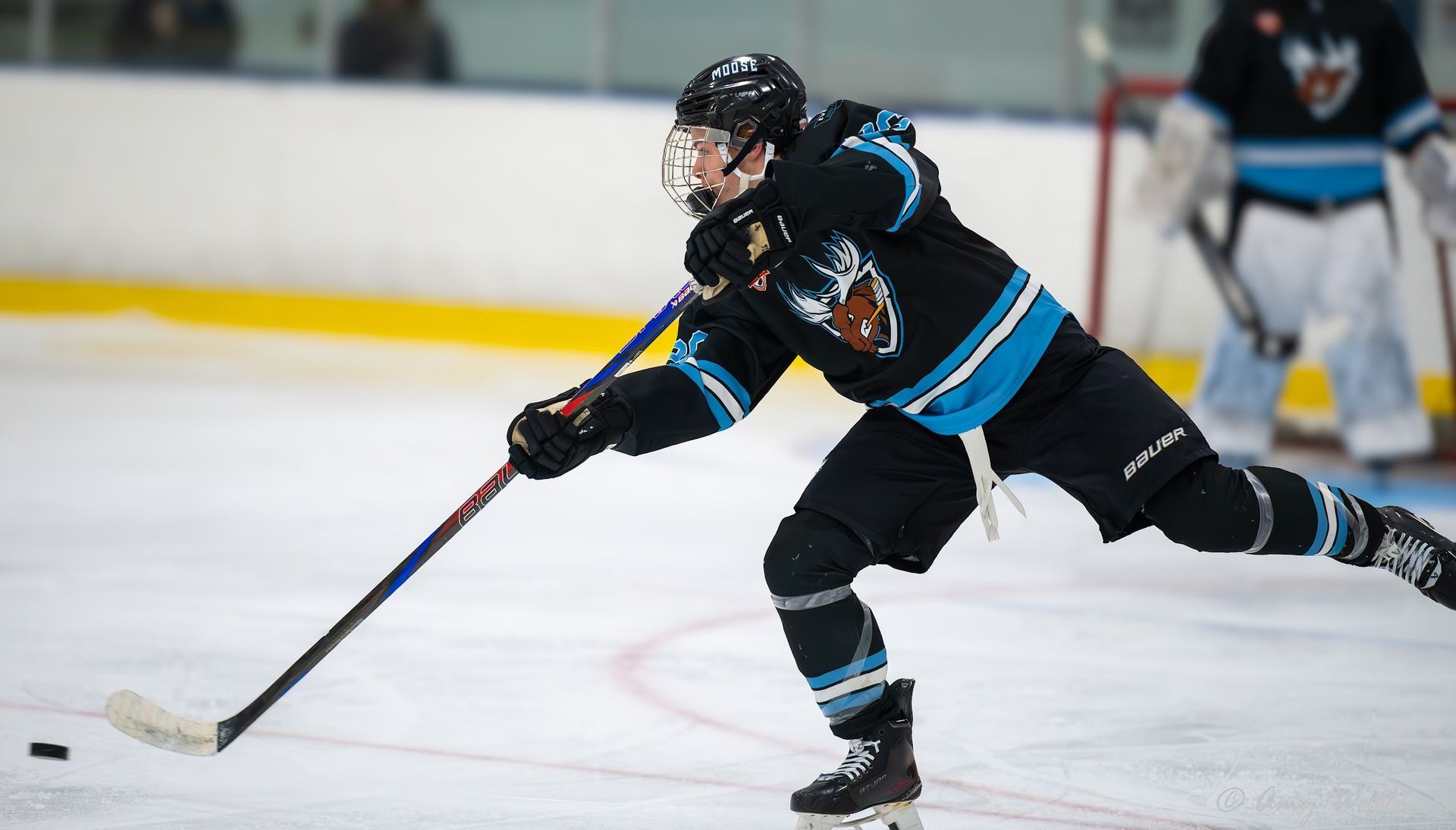 Xander Vanhorn shooting a puck