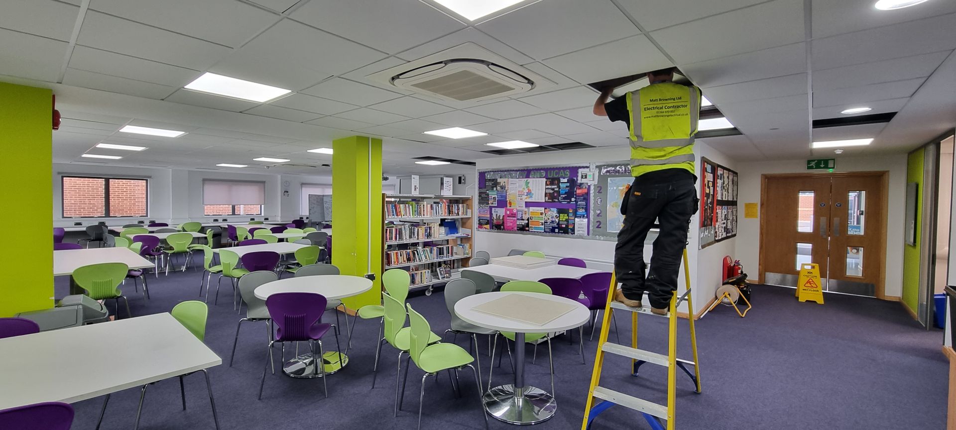 NICEIC Approved Electrician installing cables and new electrical equipment at a school in Wokingham