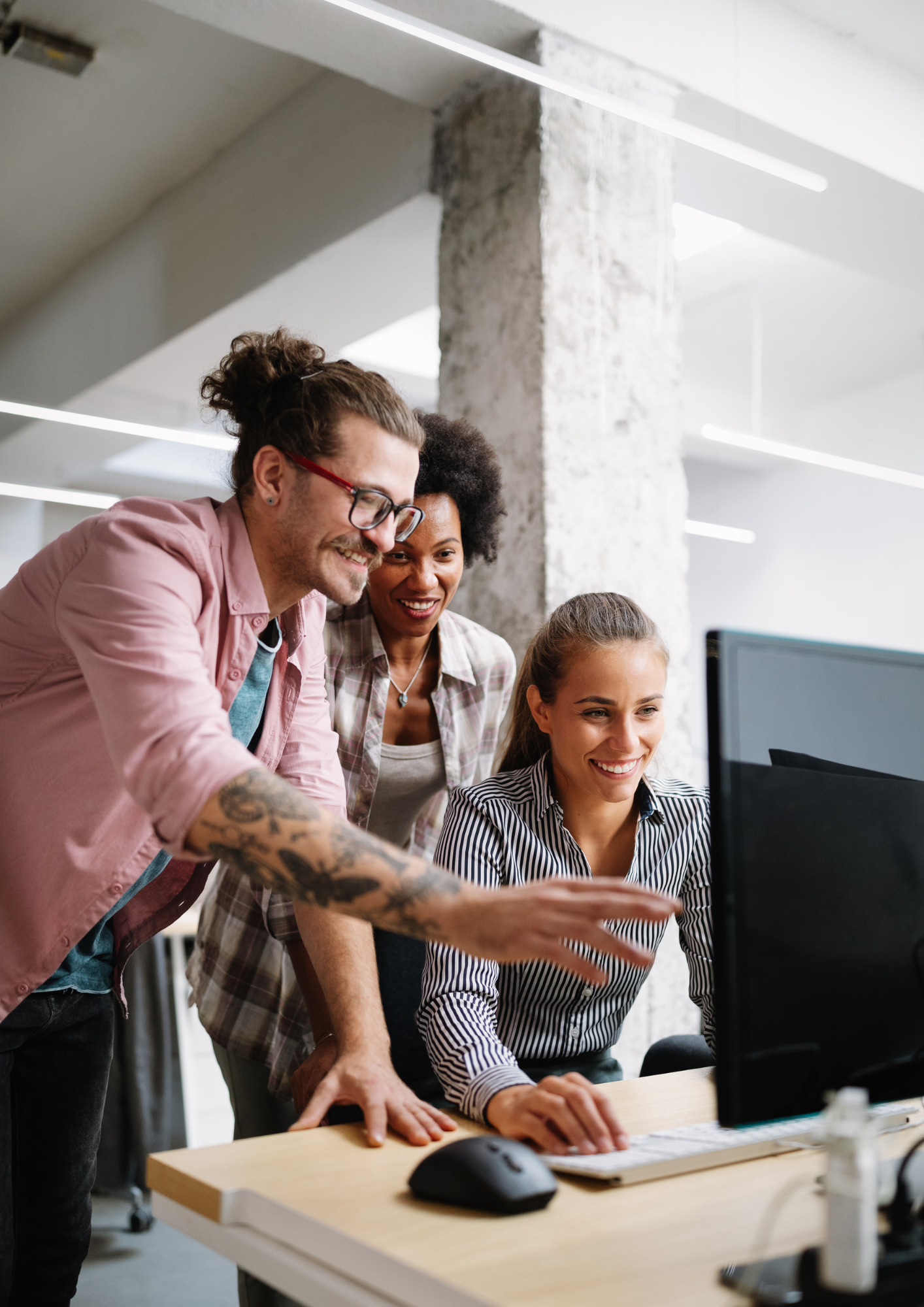 Team collaborating at a computer