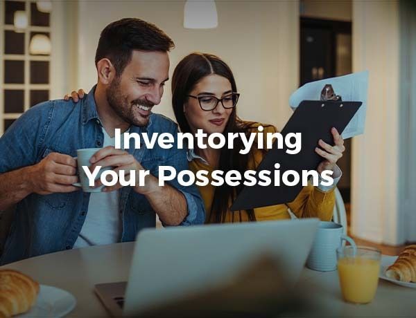 Two people reviewing a clipboard beside a laptop, overlaid with “Inventorying Your Possessions” text