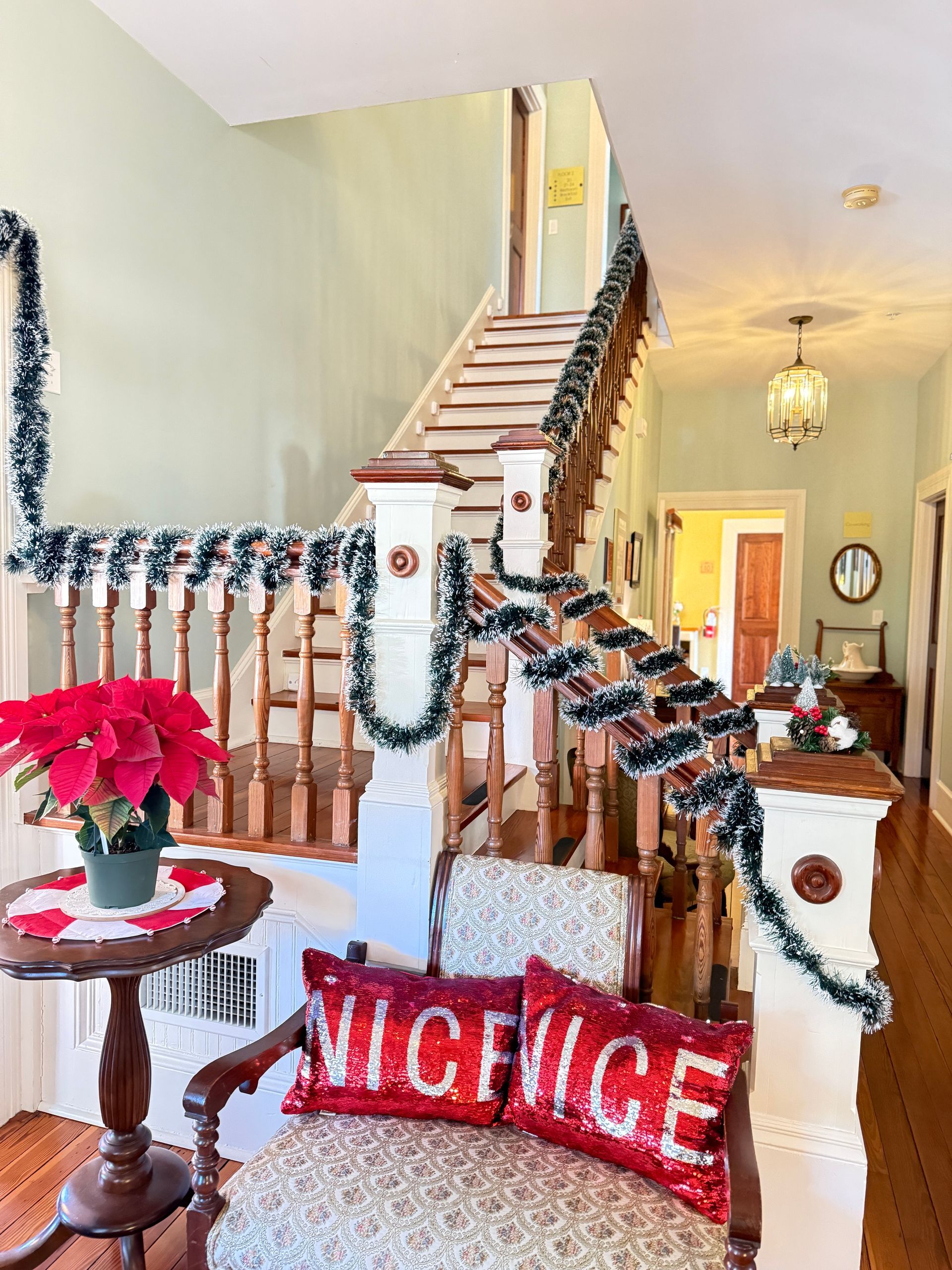 Holiday decorations on the stairwell of The Camellia Rose Inn.