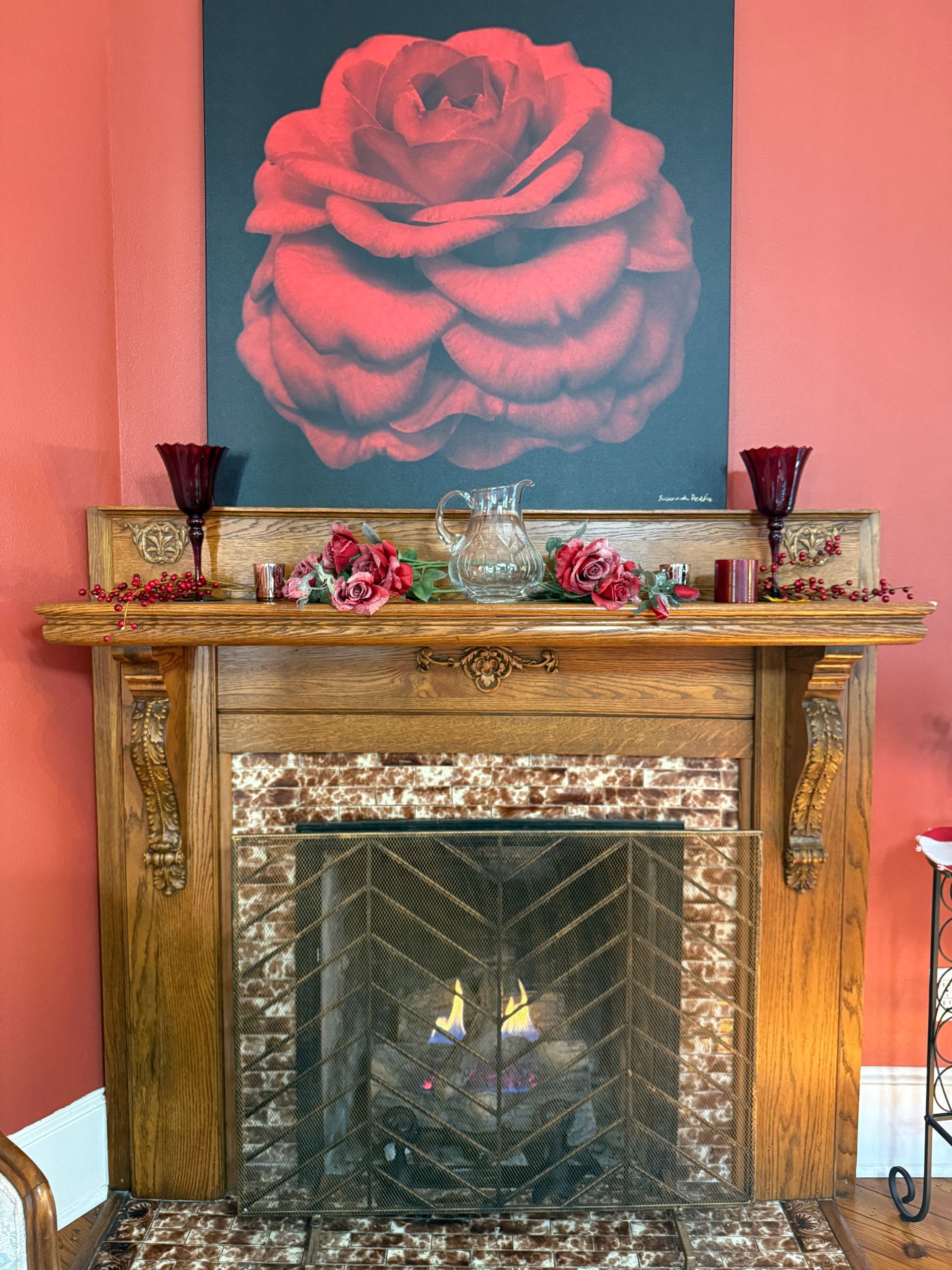 The Camellia Rose Inn decorated for Christmas. The fireplace has a fire.