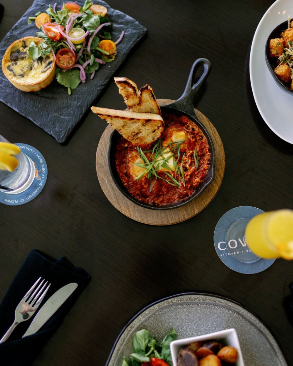 A table full of food plates at Covey Kitchen Restaurant.