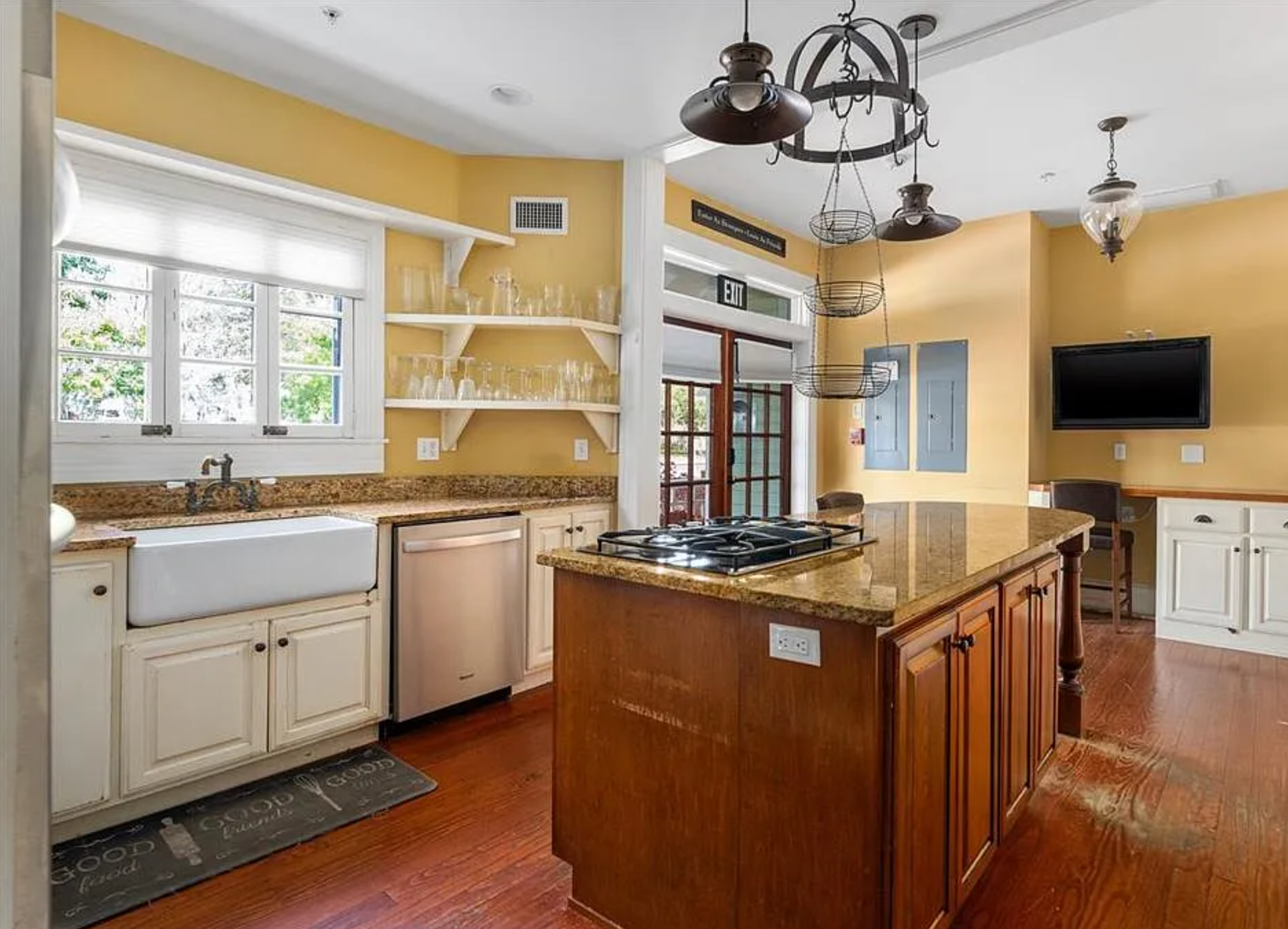 Kitchen and kitchen island in the Camellia Rose Inn - Gainesville, FL STR