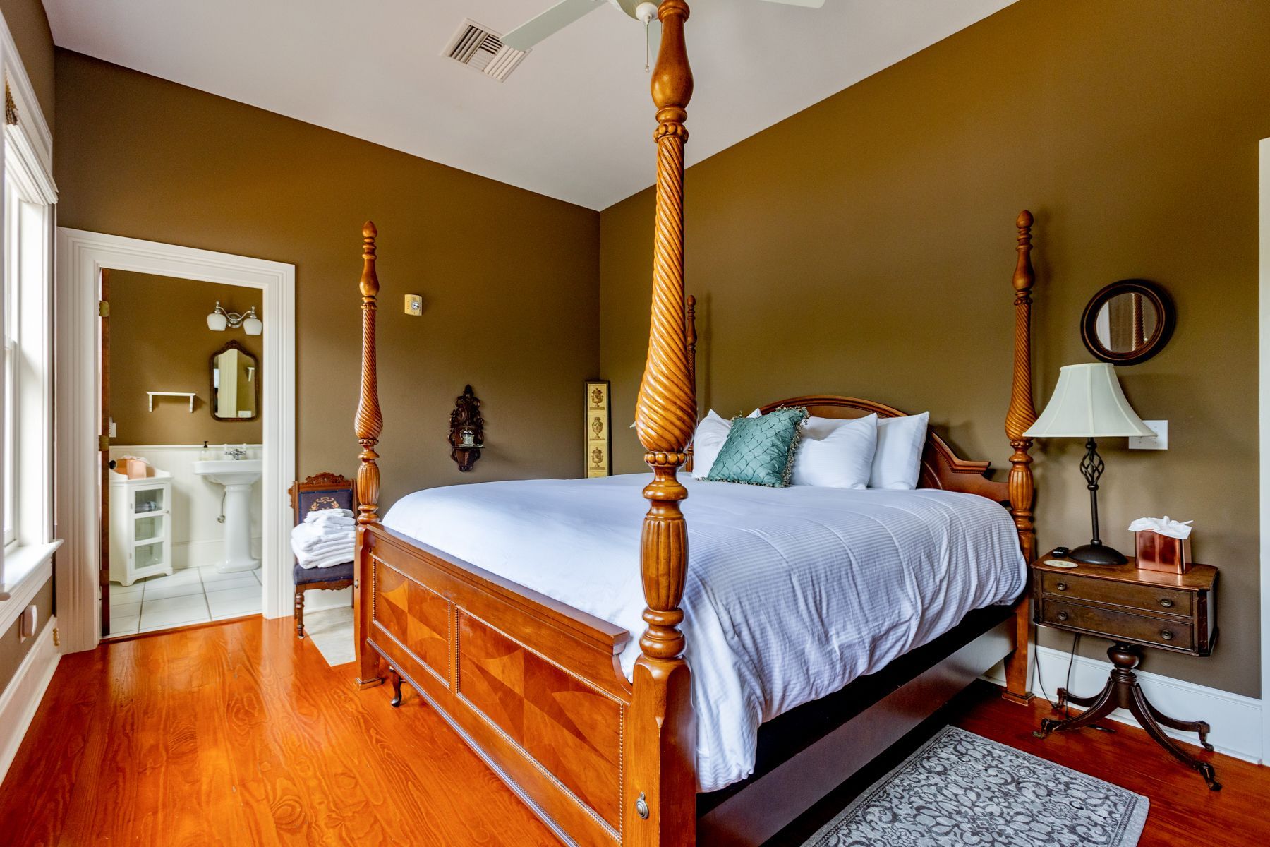 Wooden bed in The Camellia Rose Inn - STR - Vacation Rental - VRBO - AirBNB