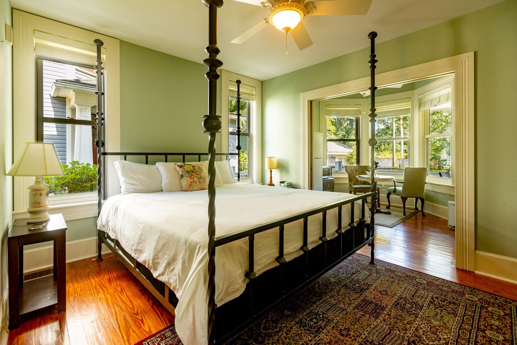 Wooden bed in The Camellia Rose Inn - STR - Vacation Rental - VRBO - AirBNB