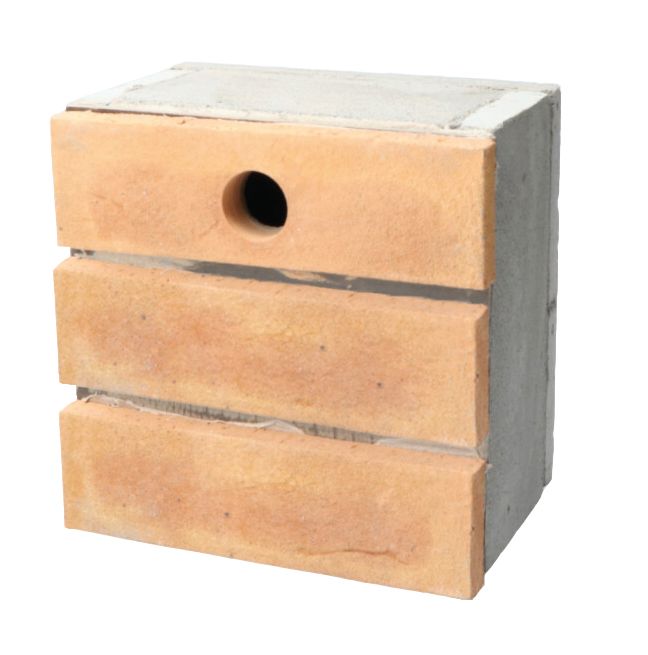 Wooden birdhouse with a round entrance hole and gray roof, isolated on white background
