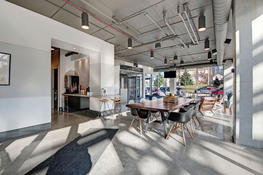 A room with a table and chairs in it.