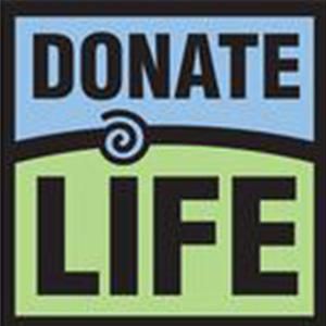 A sign that says donate life on it
