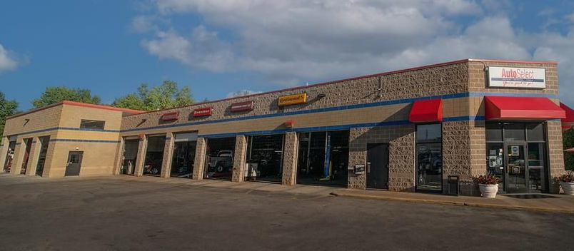 A large building with a red awning on the side of it