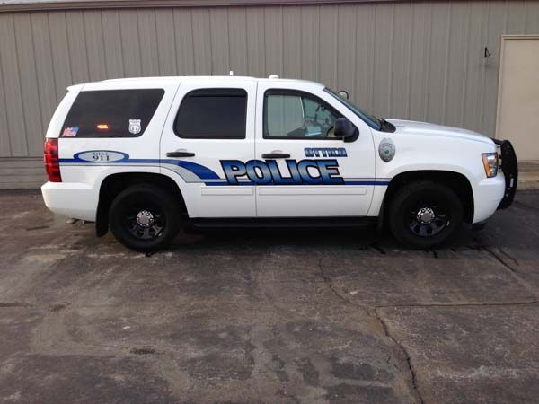 White police SUV with black wheels, 