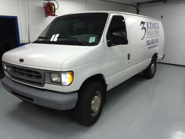 White Ford Econoline van with 