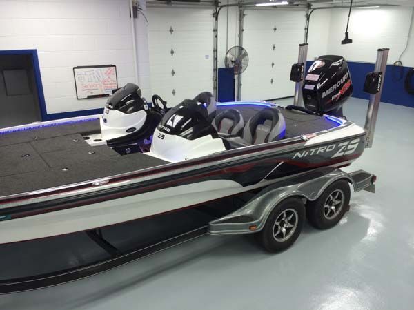 Nitro Z9 bass boat on a trailer, black, white, and red details, in a garage.