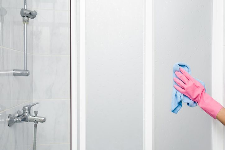 Cleaning a Shower Door — Huntington, WV — Plumbing Helper
