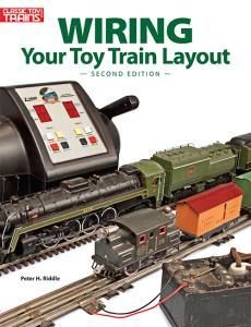 Book cover of “Wiring Your Toy Train Layout” showing a model train and control panel on tracks