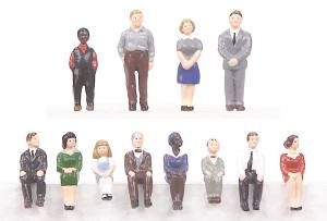 Ten small figurines standing in two rows on a white background.
