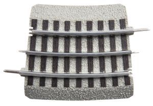 Curved section of model railroad track on gray gravel ballast