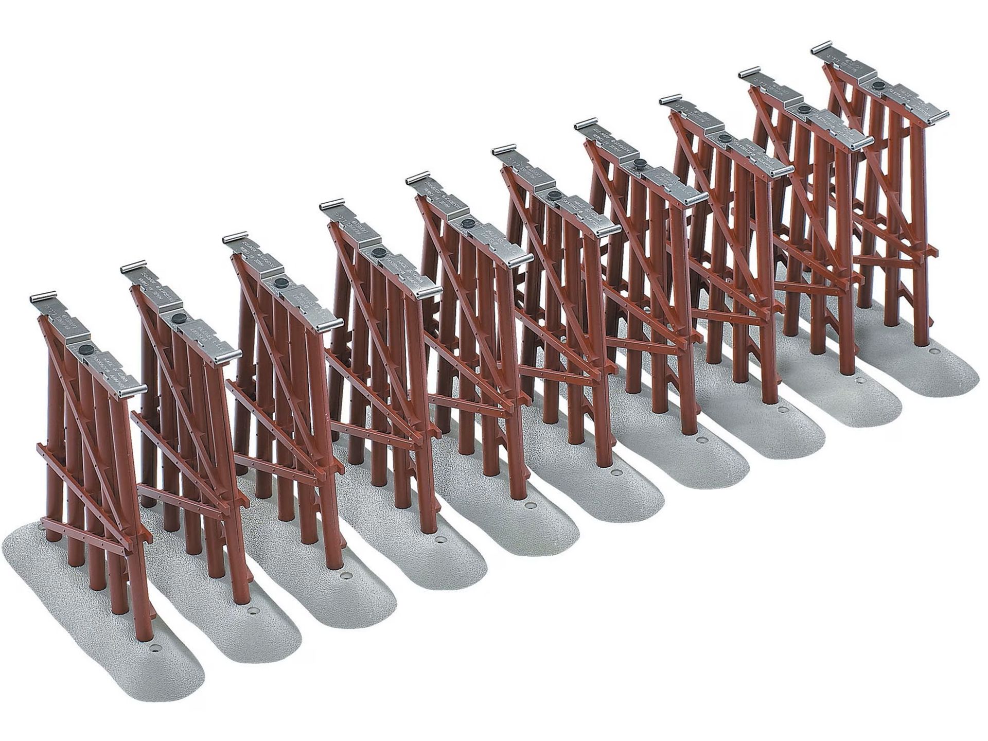 Row of small rust-red wooden bridge models on gray bases, viewed diagonally