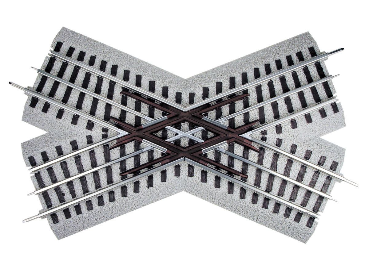Two railroad tracks crossing in an X shape, viewed from above on a white background