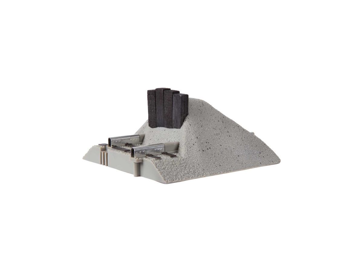 Small gray mound with three black posts and a metal structure on a white background