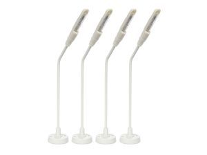 Four white adjustable floor lamps with angled heads on round bases