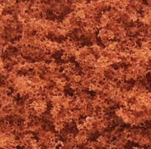 Close-up of a reddish-brown textured surface with mottled patterns
