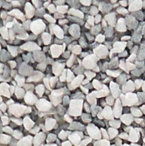 Close-up of small light gray gravel stones filling the frame