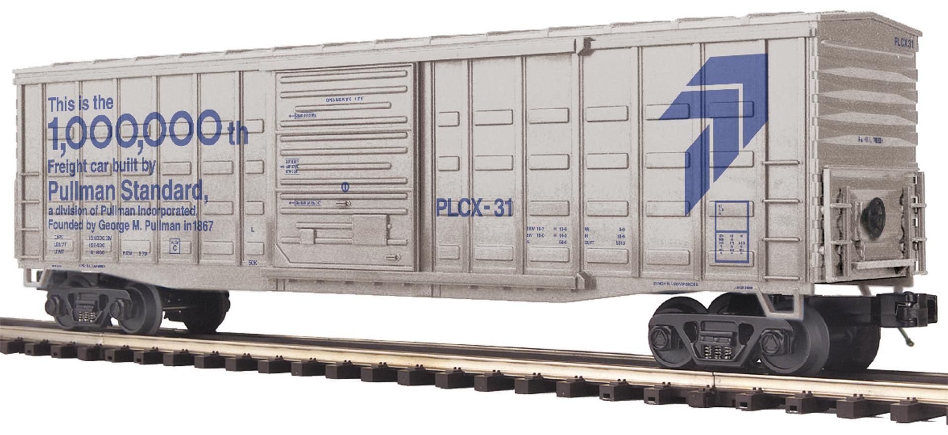 White freight boxcar with blue logos, photographed side-on on train tracks