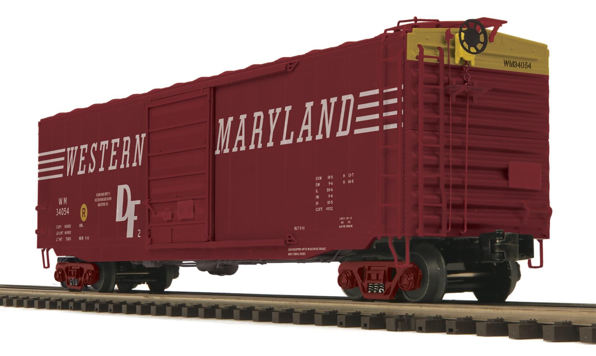 Red Western Maryland boxcar on railroad tracks, with large white lettering