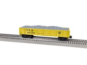 Yellow model freight car on tracks carrying gray load