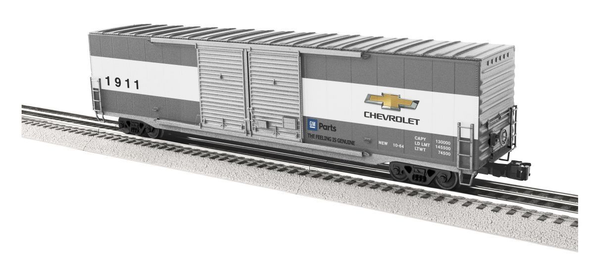 Gray and white freight boxcars on a model train track, one marked 1911.