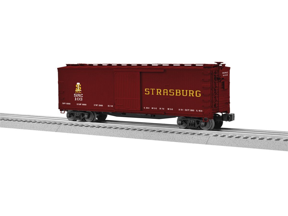Maroon Strasburg freight boxcar on railroad track