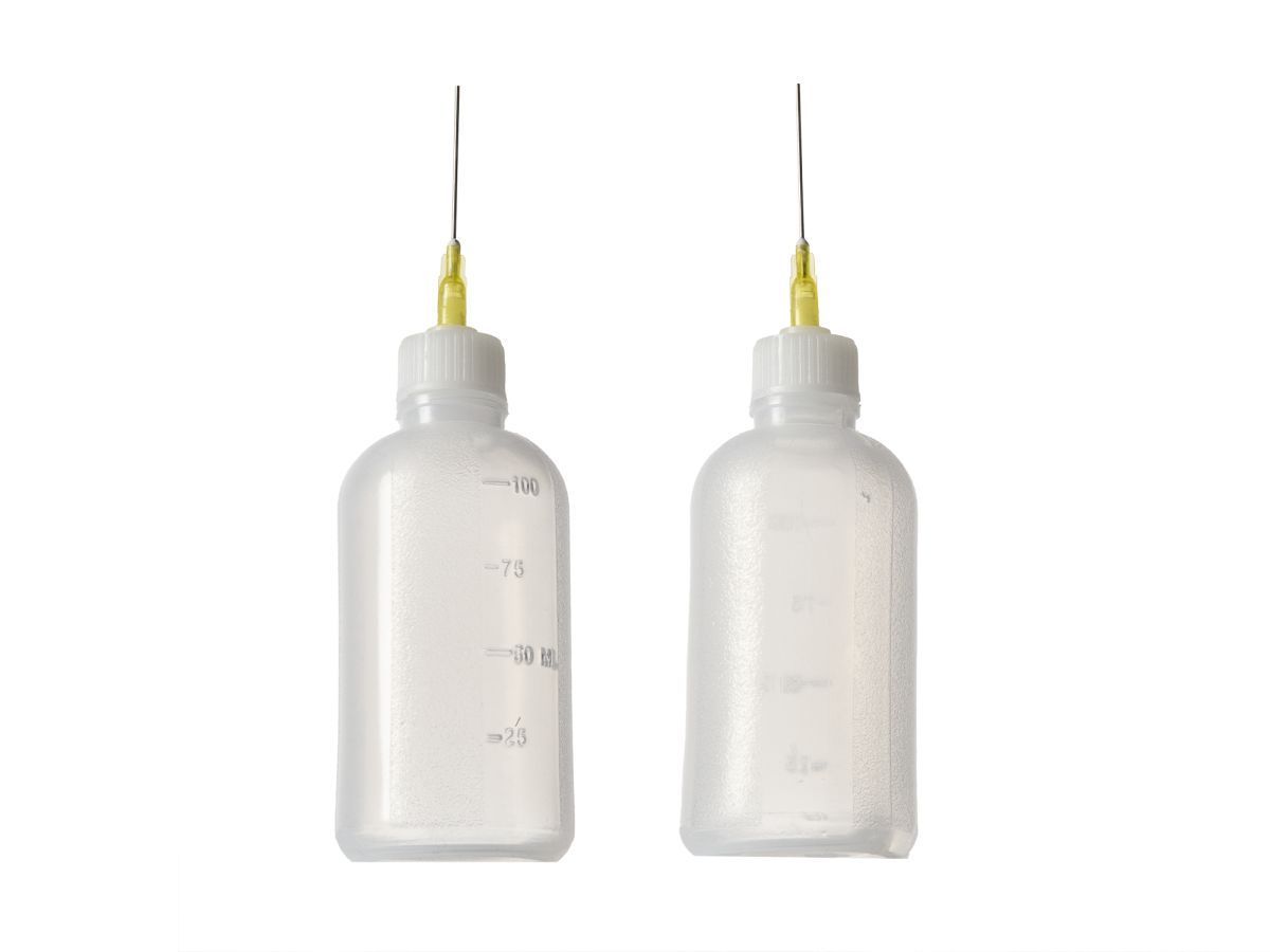 Two translucent plastic squeeze bottles with long metal needles, side by side on white background