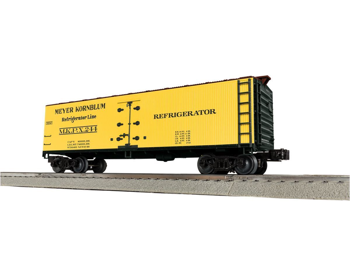 Yellow freight boxcar on railroad tracks, side view on a plain background
