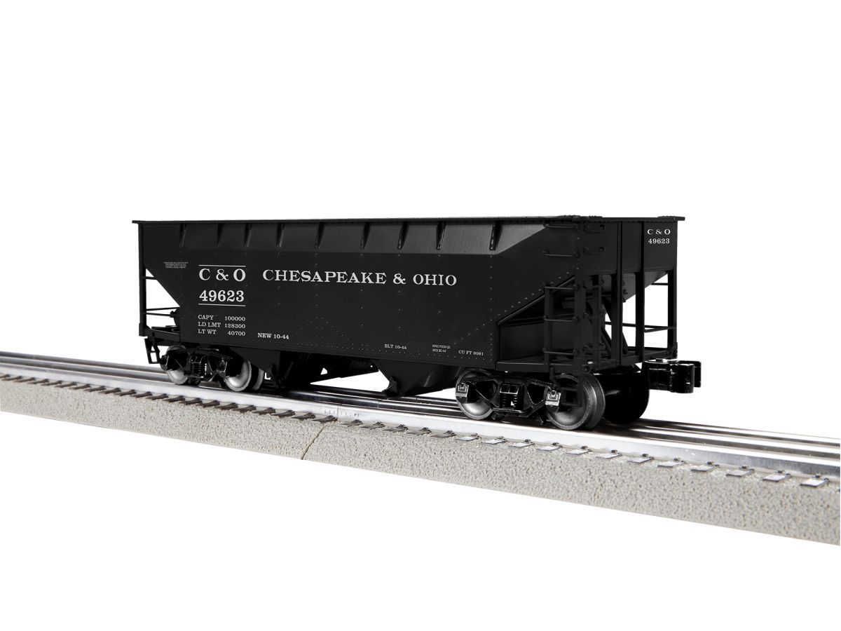 Black C&O freight train car on tracks, isolated on white background