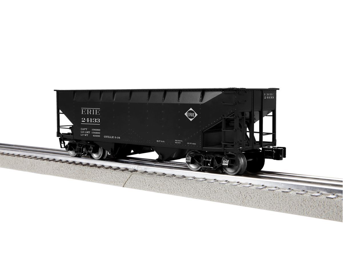 Black freight hopper railcar on tracks against a white background
